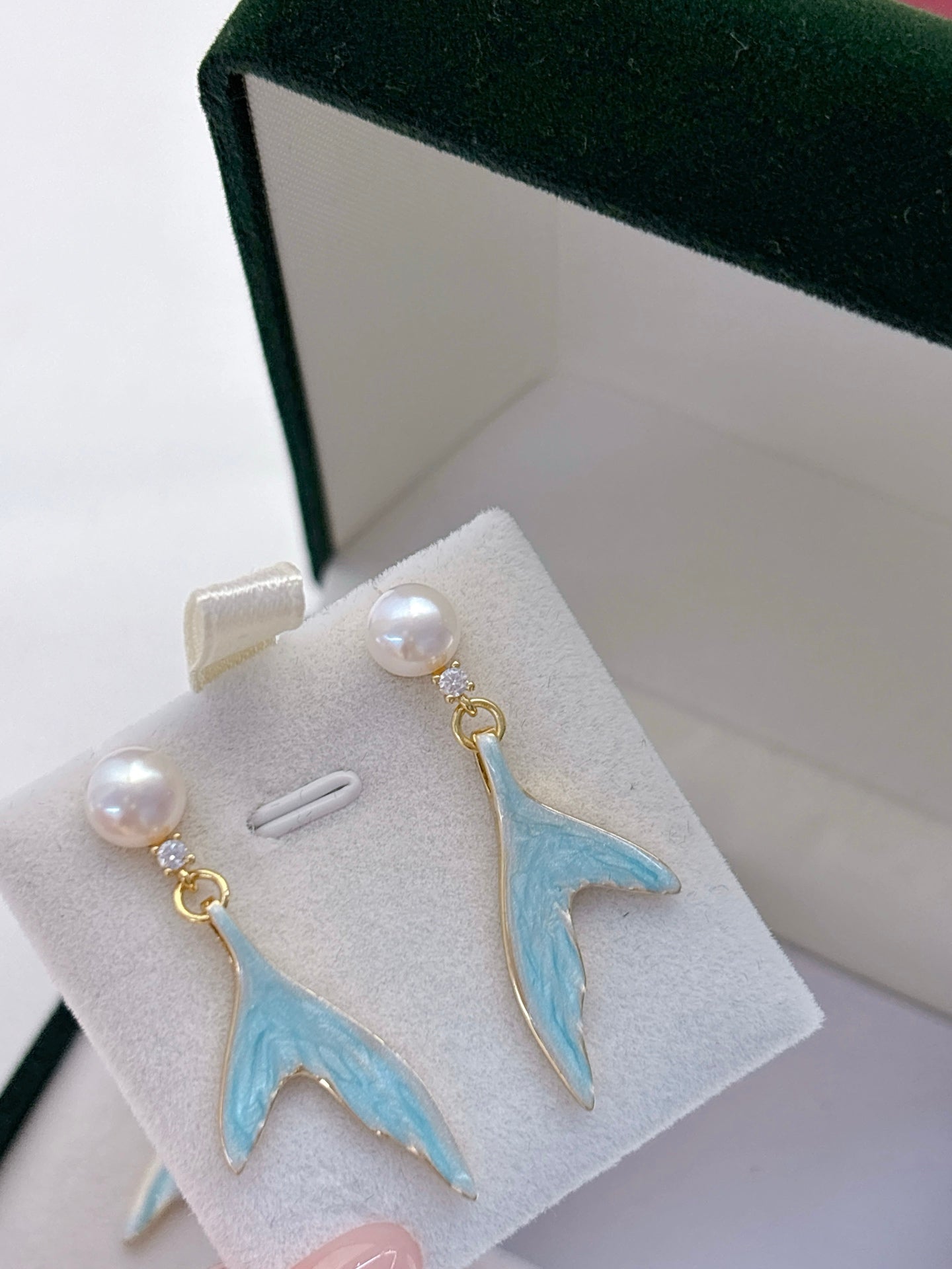 Mermaid pearl jewelry set with earrings, ring, and necklace featuring freshwater pearls and elegant fish-tail details.
