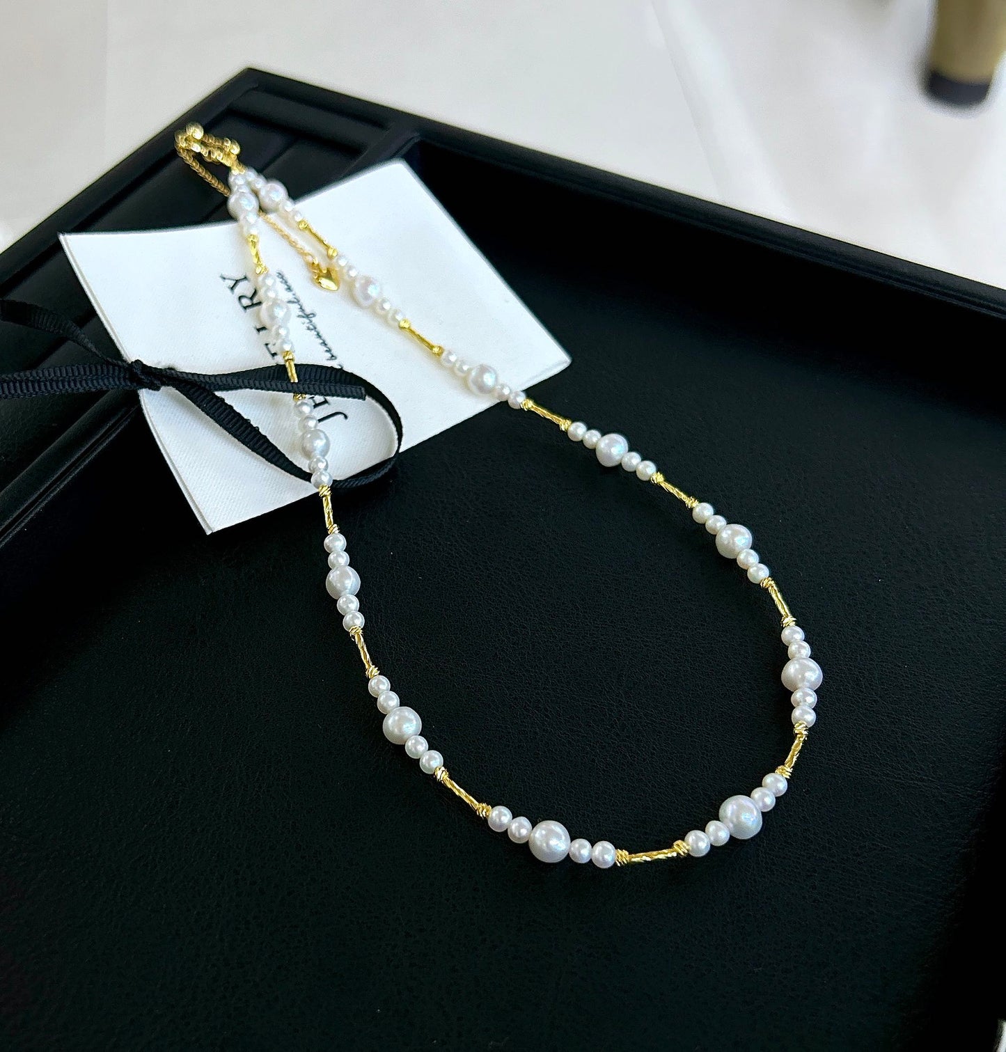 Gradient freshwater baby pearl necklace featuring 3–7mm pearls with adjustable clasp for a perfect fit.