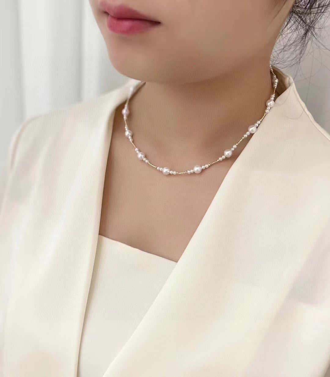 Gradient freshwater baby pearl necklace featuring 3–7mm pearls with adjustable clasp for a perfect fit.