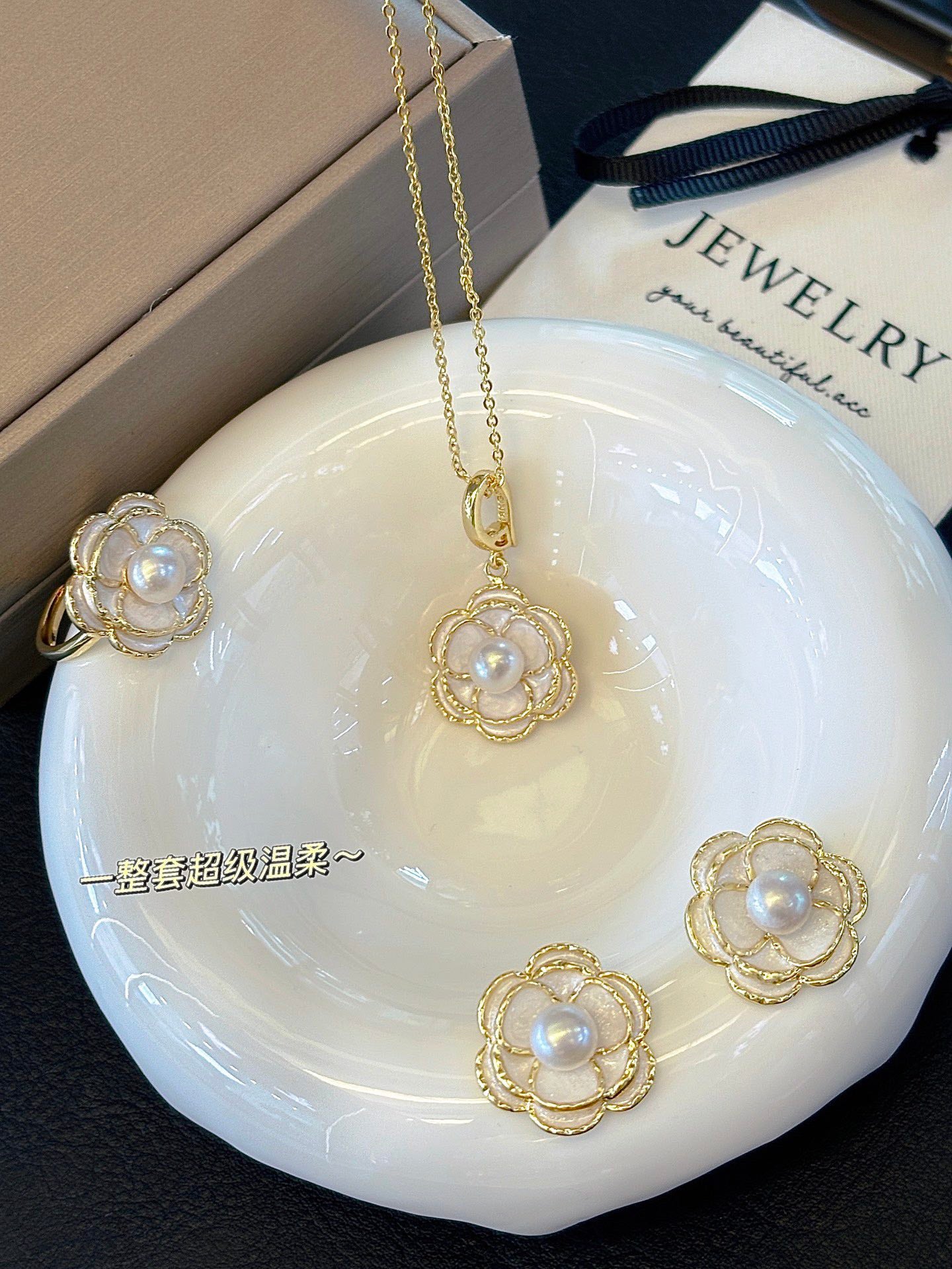 Vintage-style camellia pearl jewelry set featuring freshwater pearls and 14k gold-plated detailing.