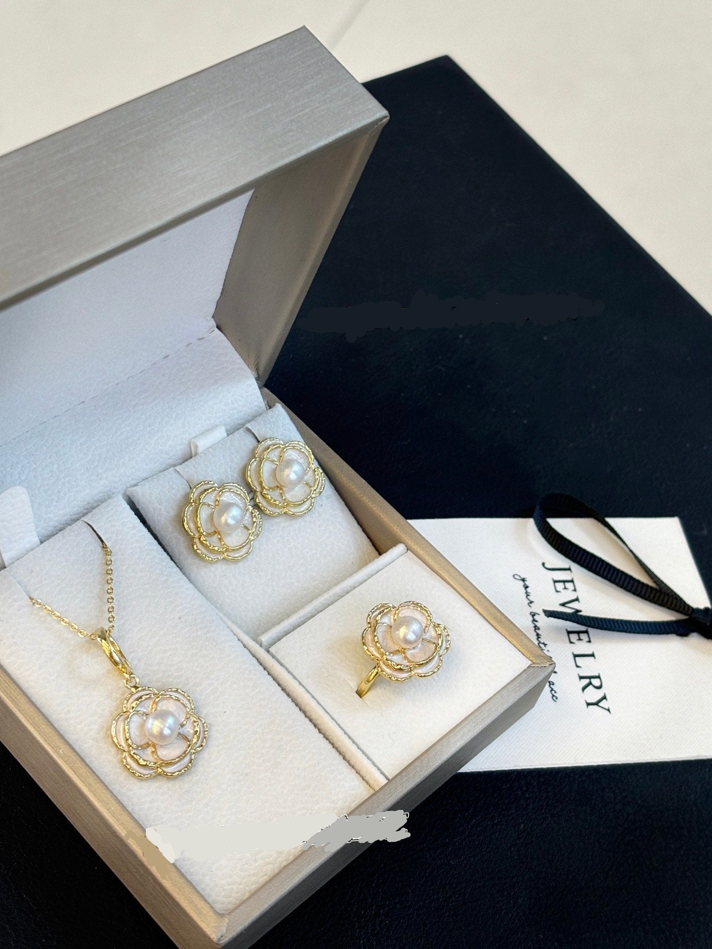 Vintage-style camellia pearl jewelry set featuring freshwater pearls and 14k gold-plated detailing.