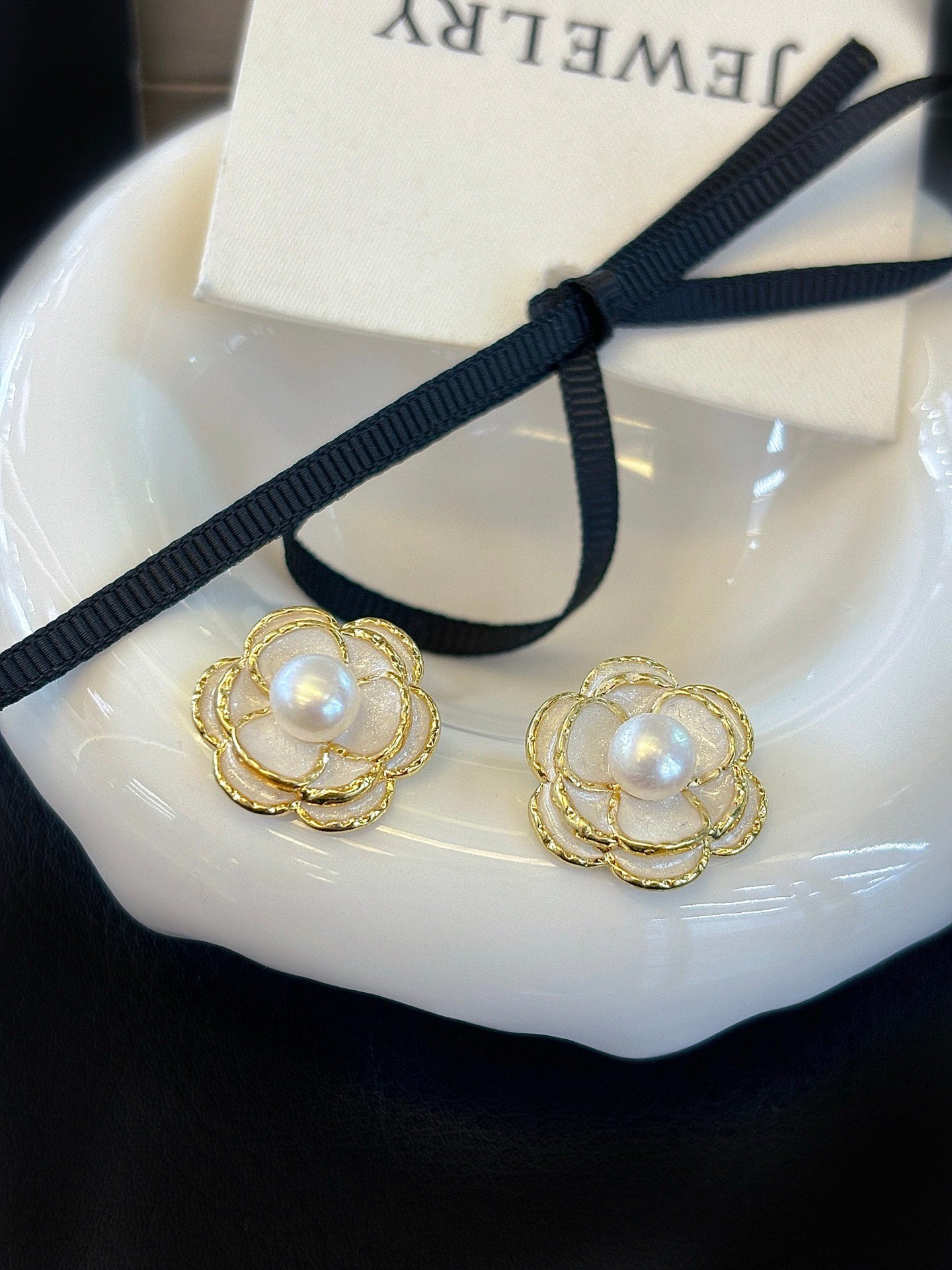 Vintage-style camellia pearl jewelry set featuring freshwater pearls and 14k gold-plated detailing.