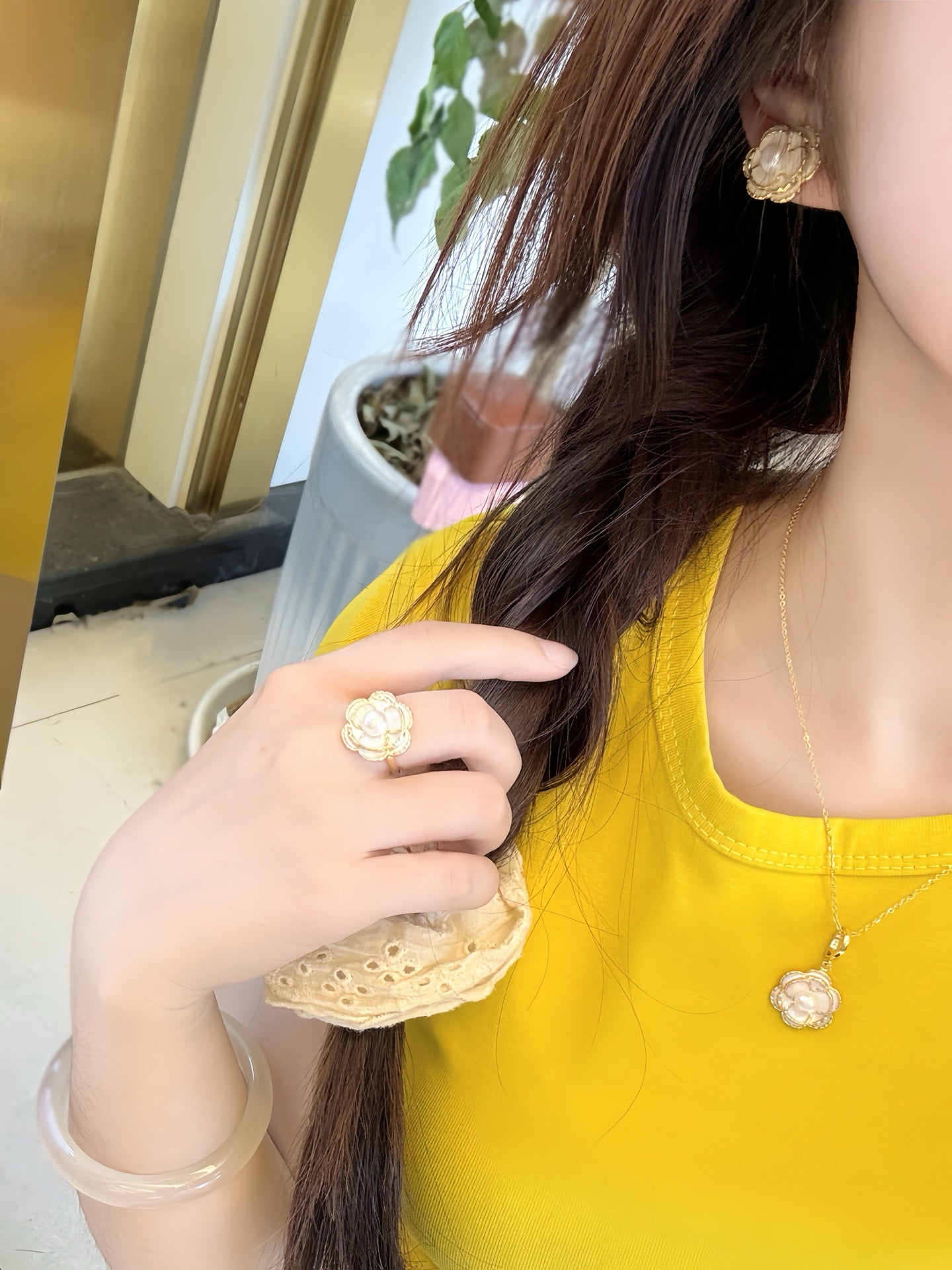 Vintage-style camellia pearl jewelry set featuring freshwater pearls and 14k gold-plated detailing.