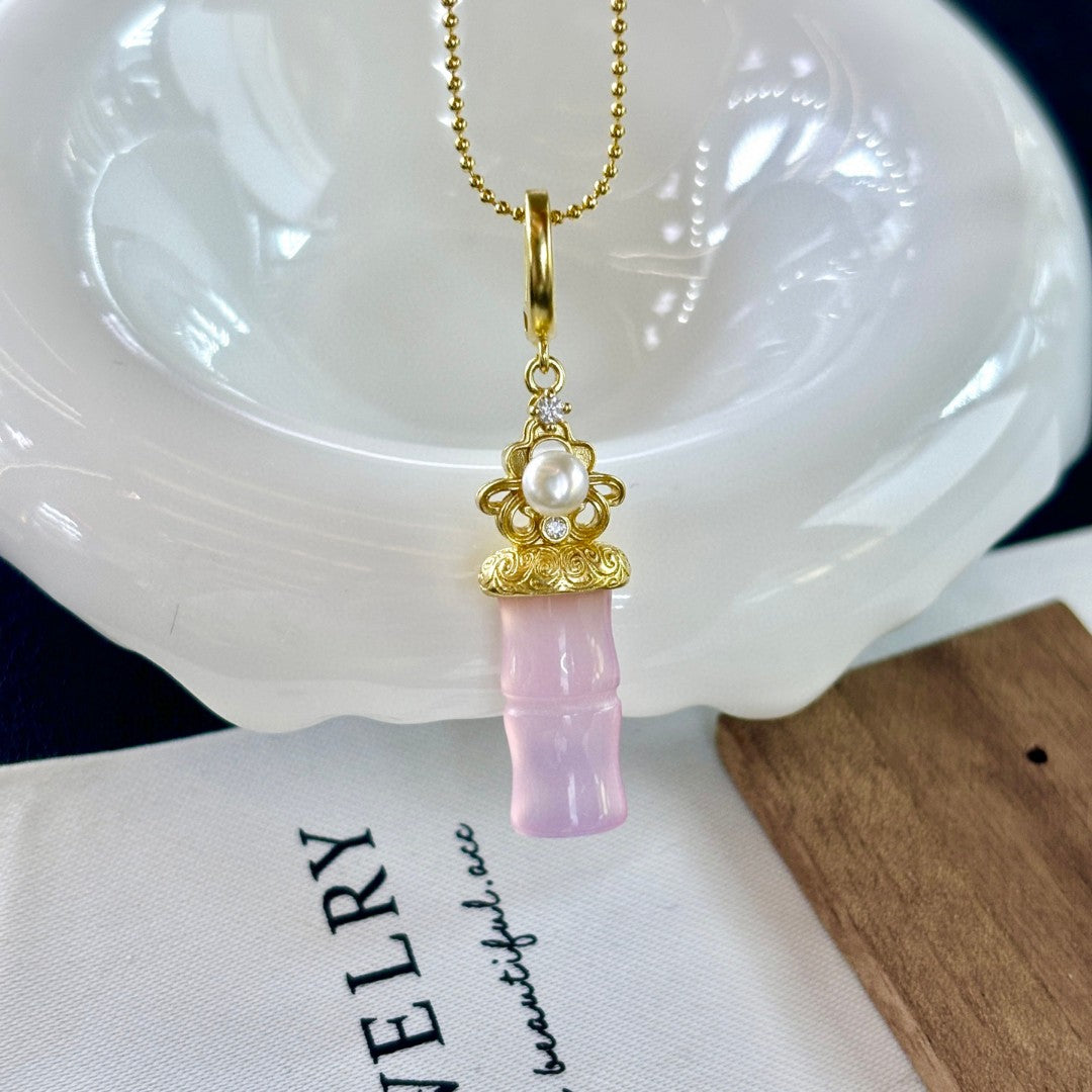 Jade and freshwater pearl pendant with bamboo-inspired gold accent