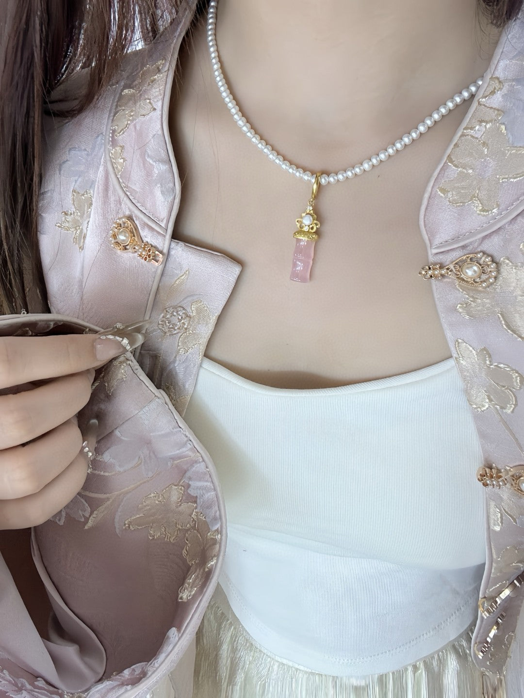 Jade and freshwater pearl pendant with bamboo-inspired gold accent