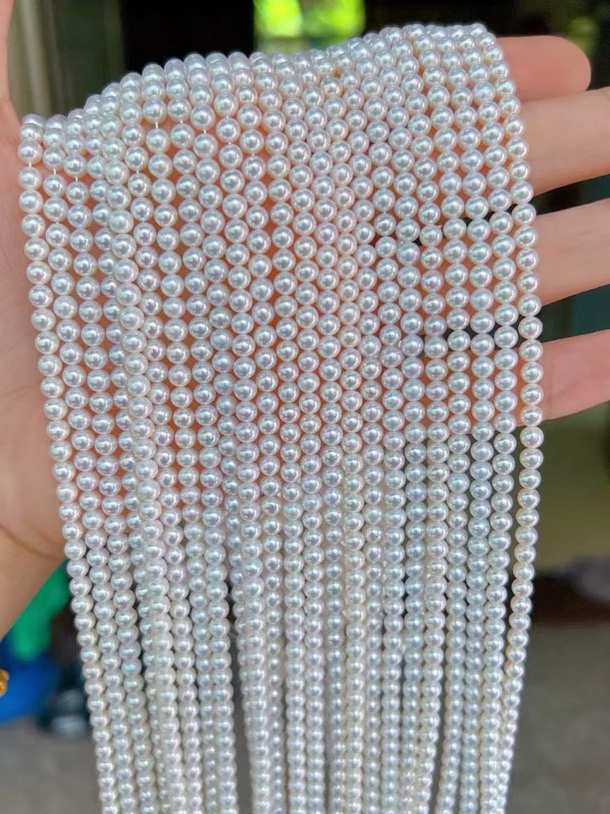High-luster near-round freshwater pearl necklace with bonus pearl studs