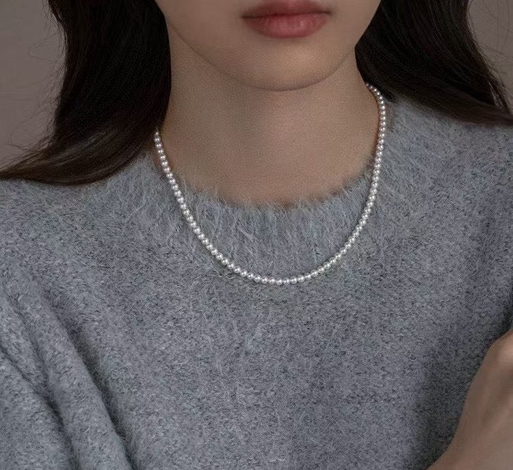 High-luster near-round freshwater pearl necklace with bonus pearl studs