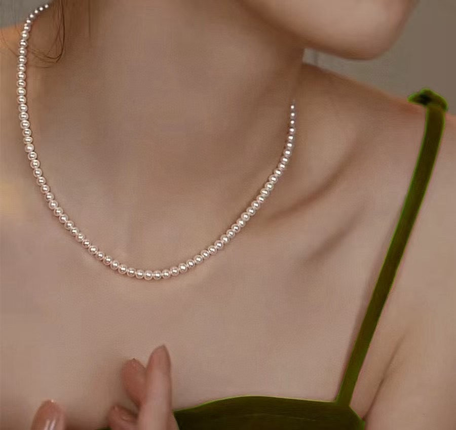 High-luster near-round freshwater pearl necklace with bonus pearl studs