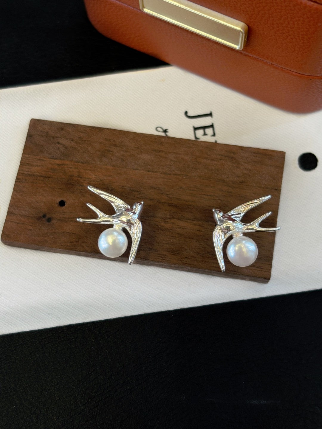 Silver swallow earrings with freshwater pearls by AnSes & Co.