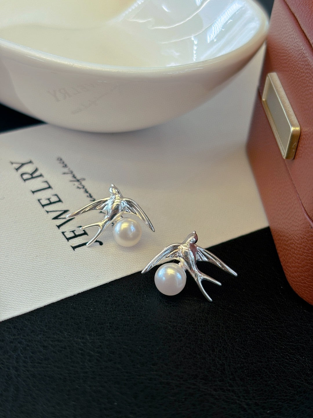 Silver swallow earrings with freshwater pearls by AnSes & Co.
