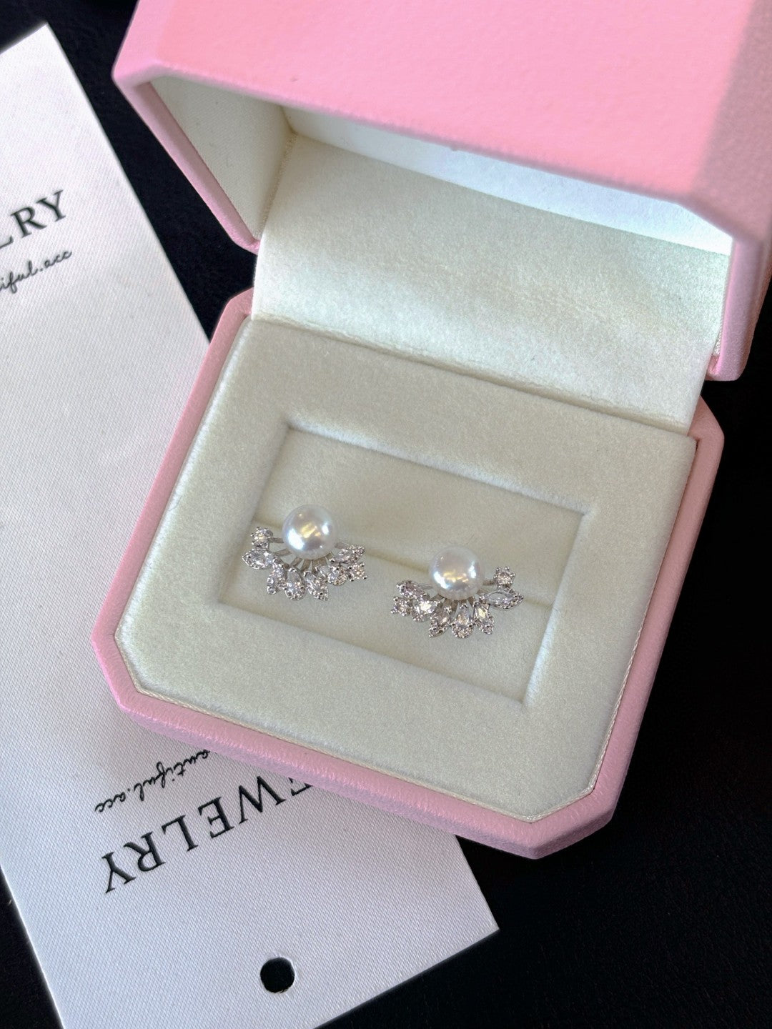 Radiant freshwater pearl stud earrings set in sterling silver.