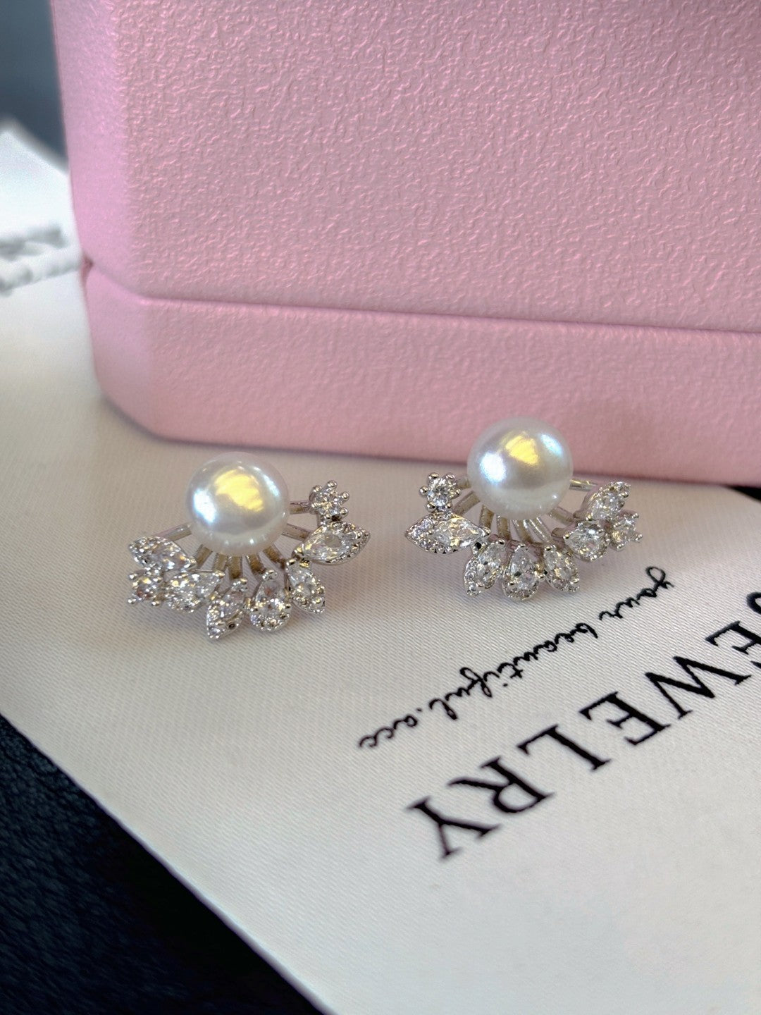 Radiant freshwater pearl stud earrings set in sterling silver.