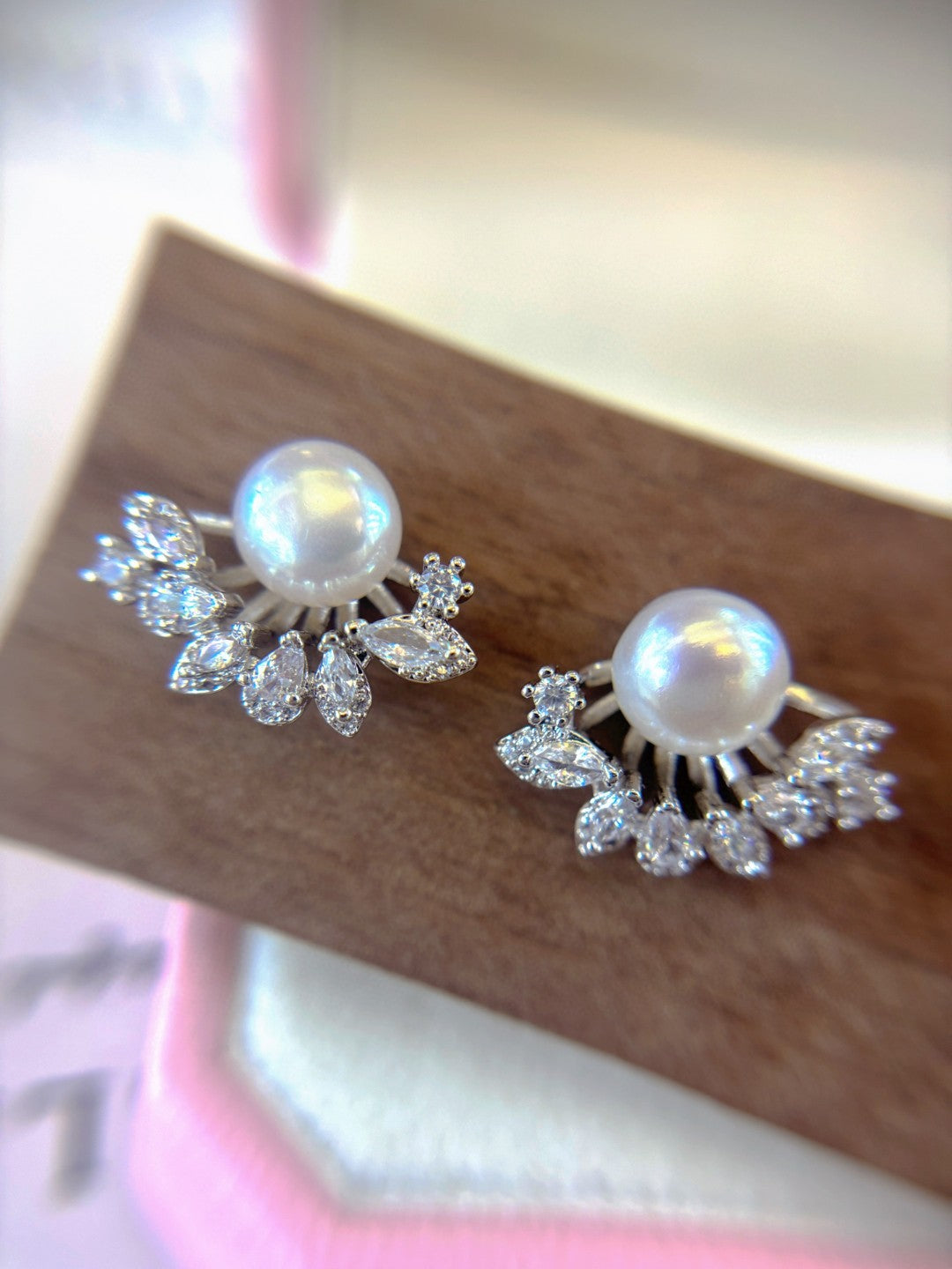 Radiant freshwater pearl stud earrings set in sterling silver.