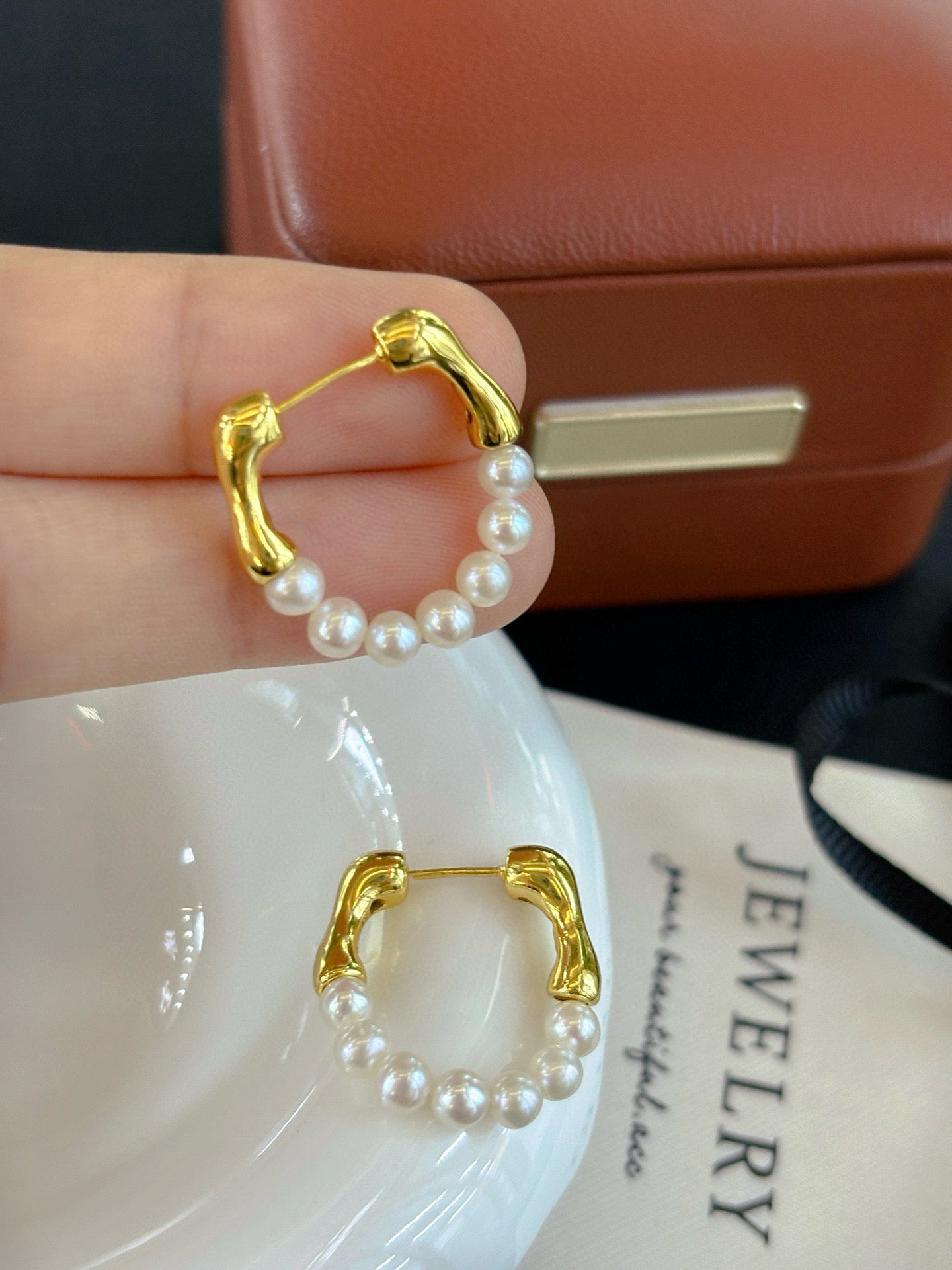 French-style vintage pearl earrings with dual-wear swing design.