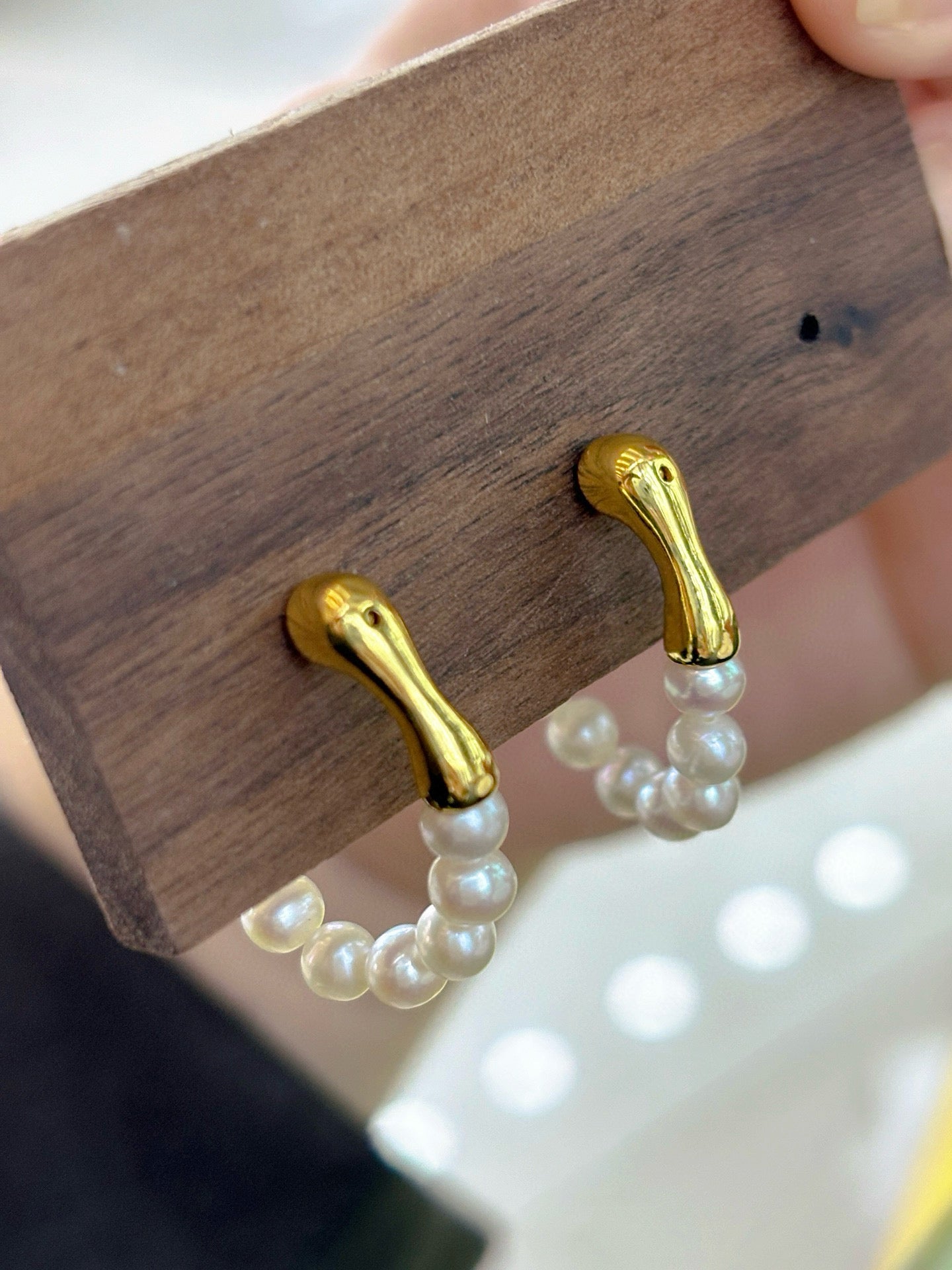 French-style vintage pearl earrings with dual-wear swing design.