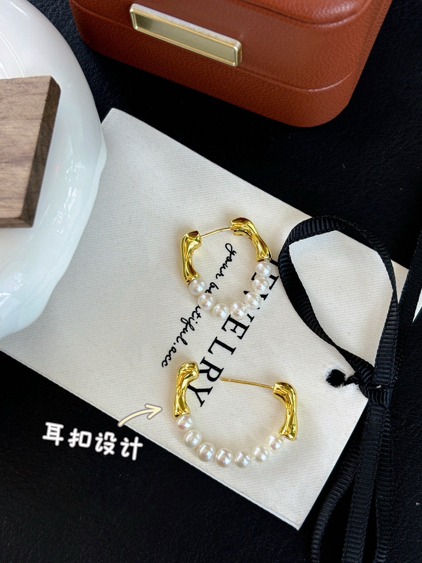 French-style vintage pearl earrings with dual-wear swing design.