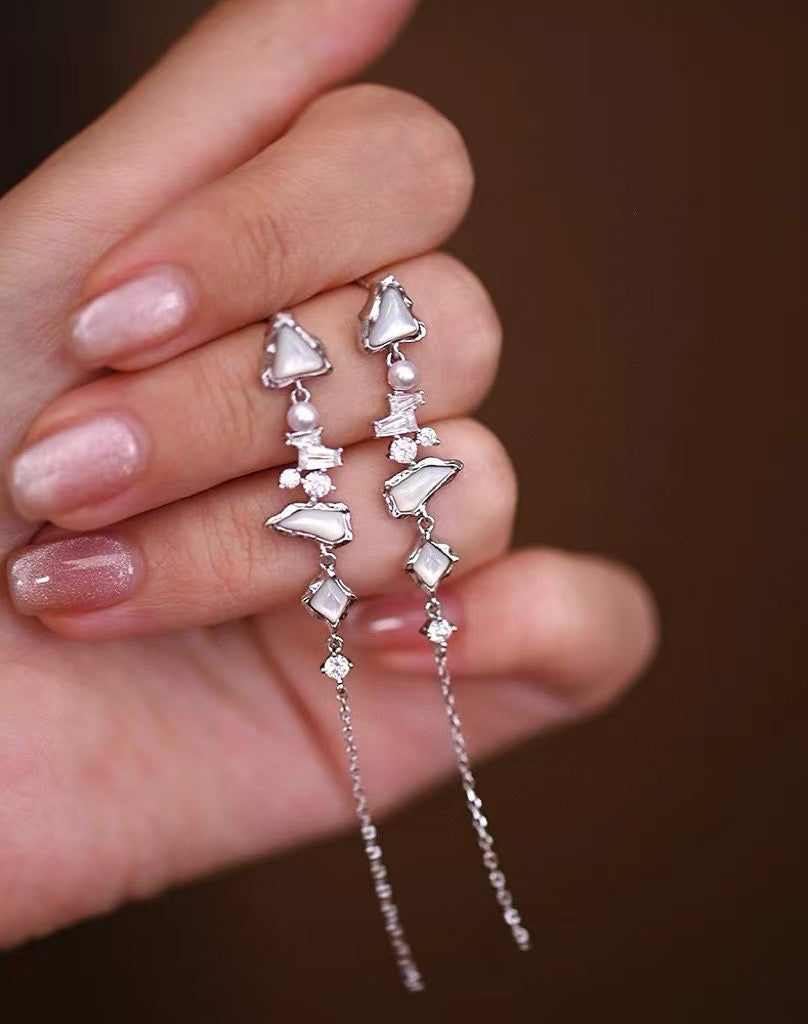 Glacier Cascade earrings with freshwater pearls, inspired by iceflow and cascading glacier forms.