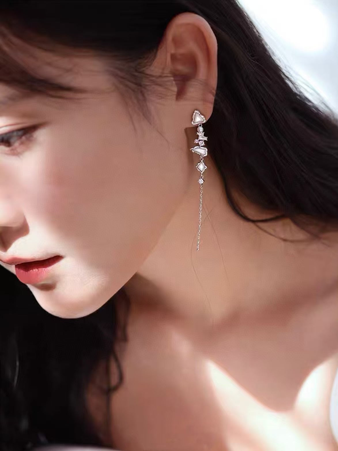 Glacier Cascade earrings with freshwater pearls, inspired by iceflow and cascading glacier forms.