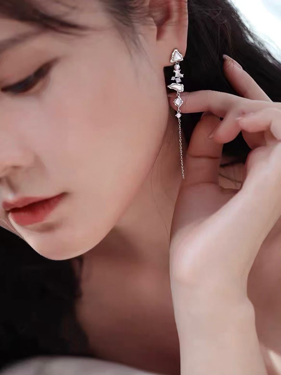 Glacier Cascade earrings with freshwater pearls, inspired by iceflow and cascading glacier forms.