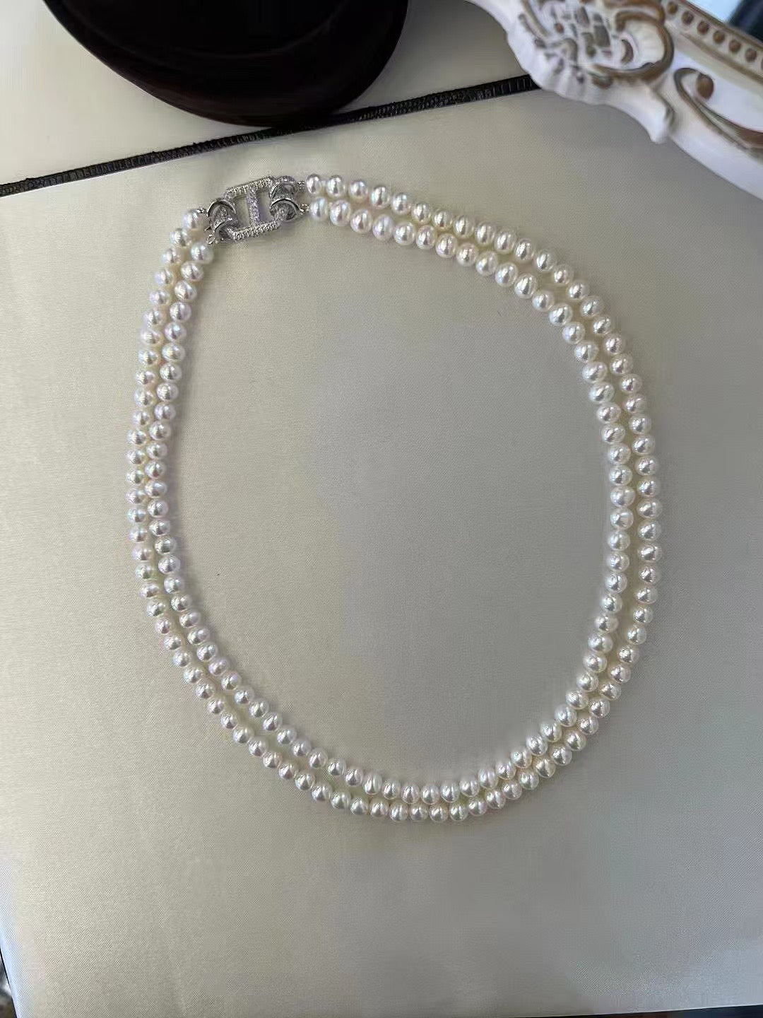 Elegant double-layer freshwater pearl choker with gold zircon clasp