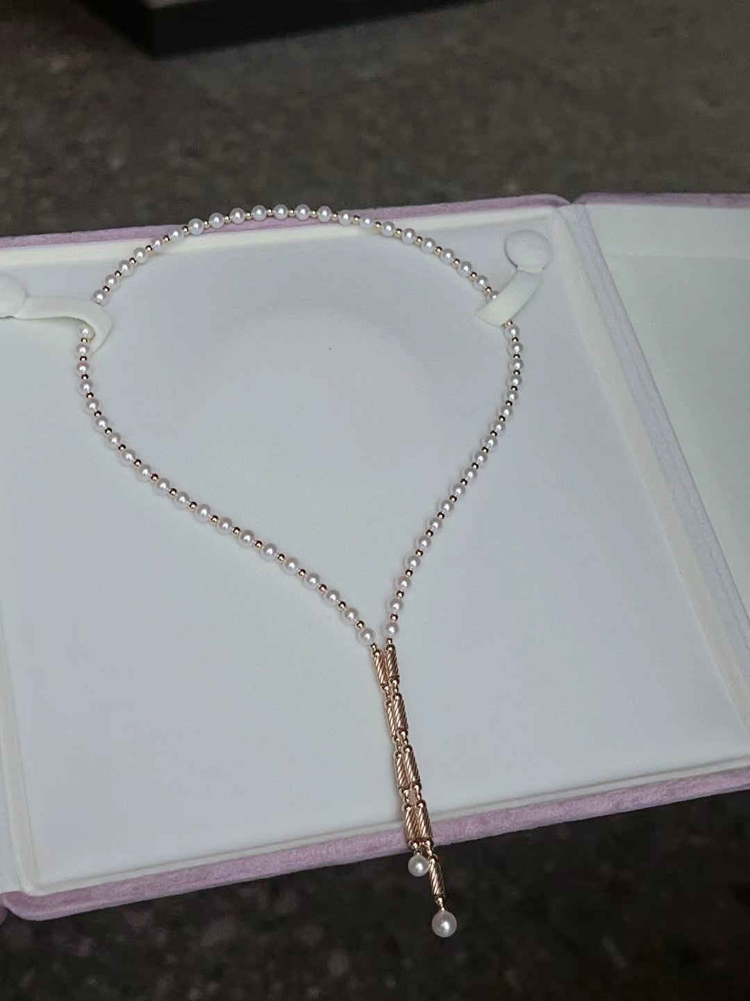 Convertible pearl necklace with magnetic clasp, showing multiple wearing styles