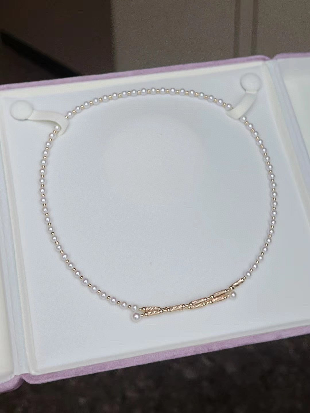Convertible pearl necklace with magnetic clasp, showing multiple wearing styles