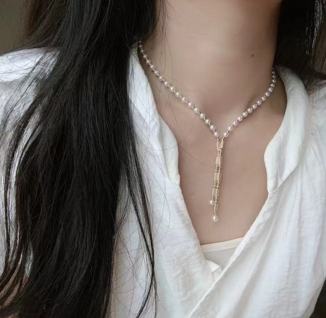 Convertible pearl necklace with magnetic clasp, showing multiple wearing styles