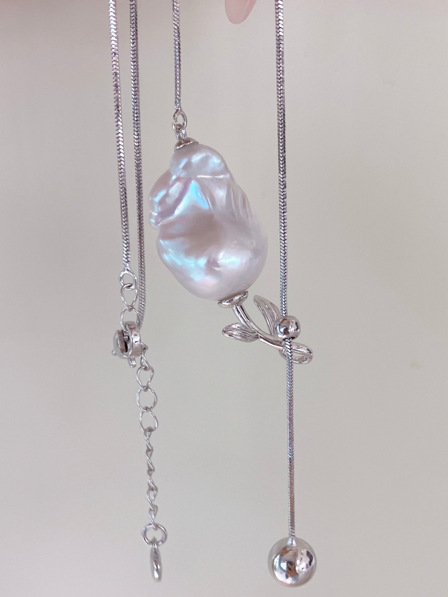 Y-shaped necklace with baroque freshwater pearls and rose charm, adjustable design
