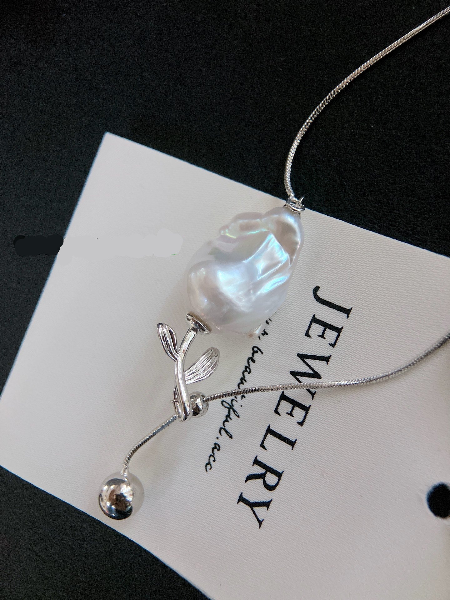 Y-shaped necklace with baroque freshwater pearls and rose charm, adjustable design