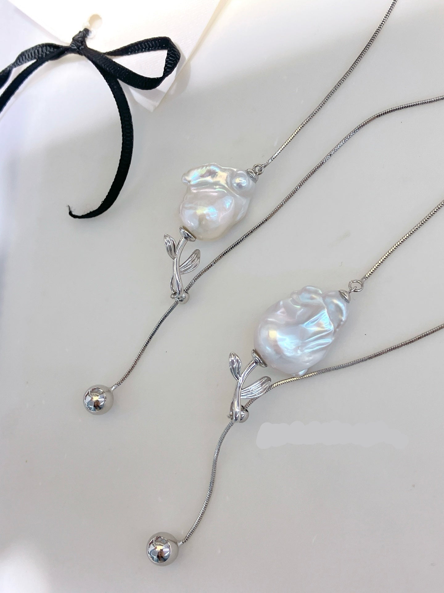 Y-shaped necklace with baroque freshwater pearls and rose charm, adjustable design