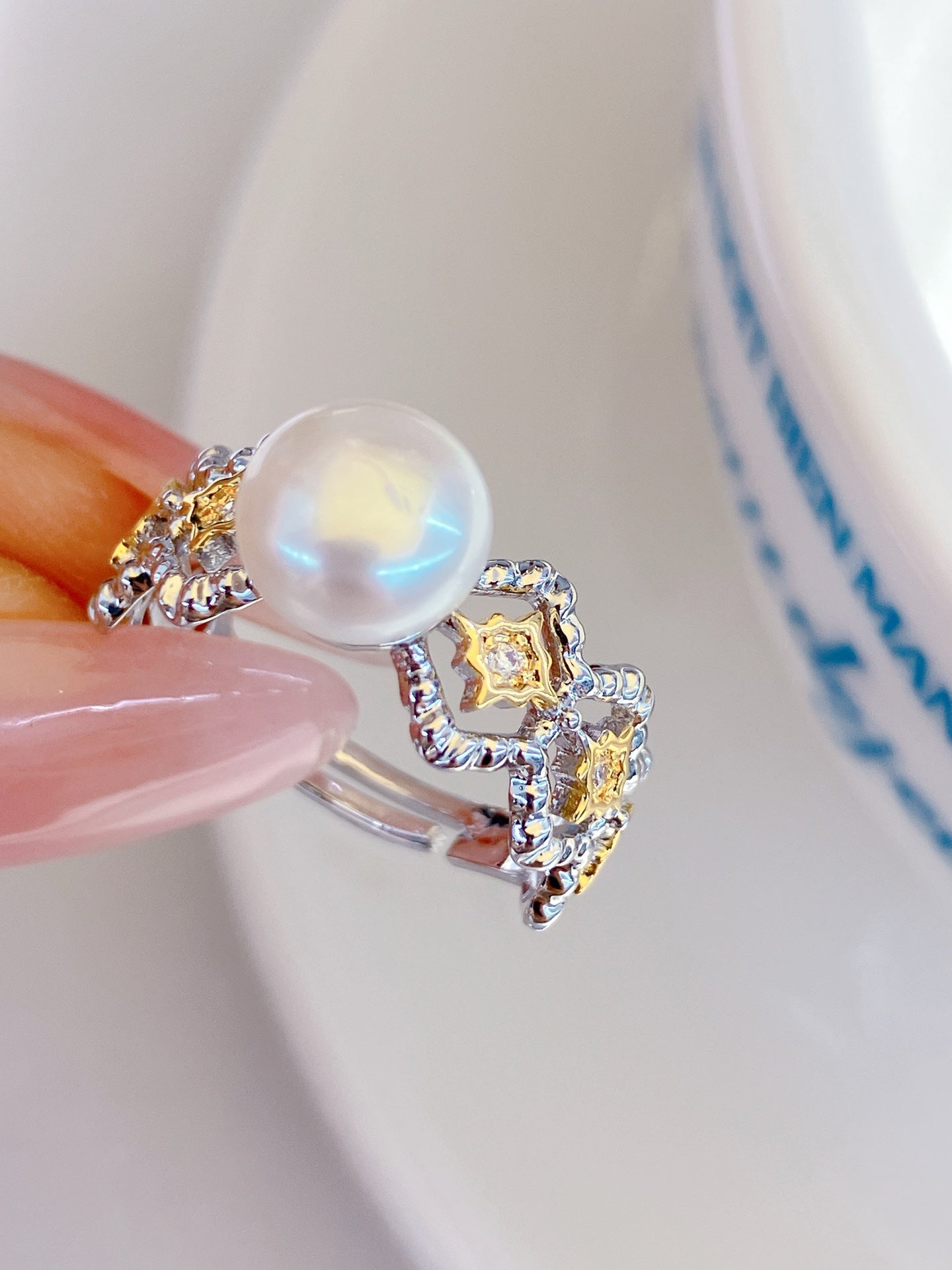 Adjustable gold open ring with geometric cut-out design and freshwater pearl
