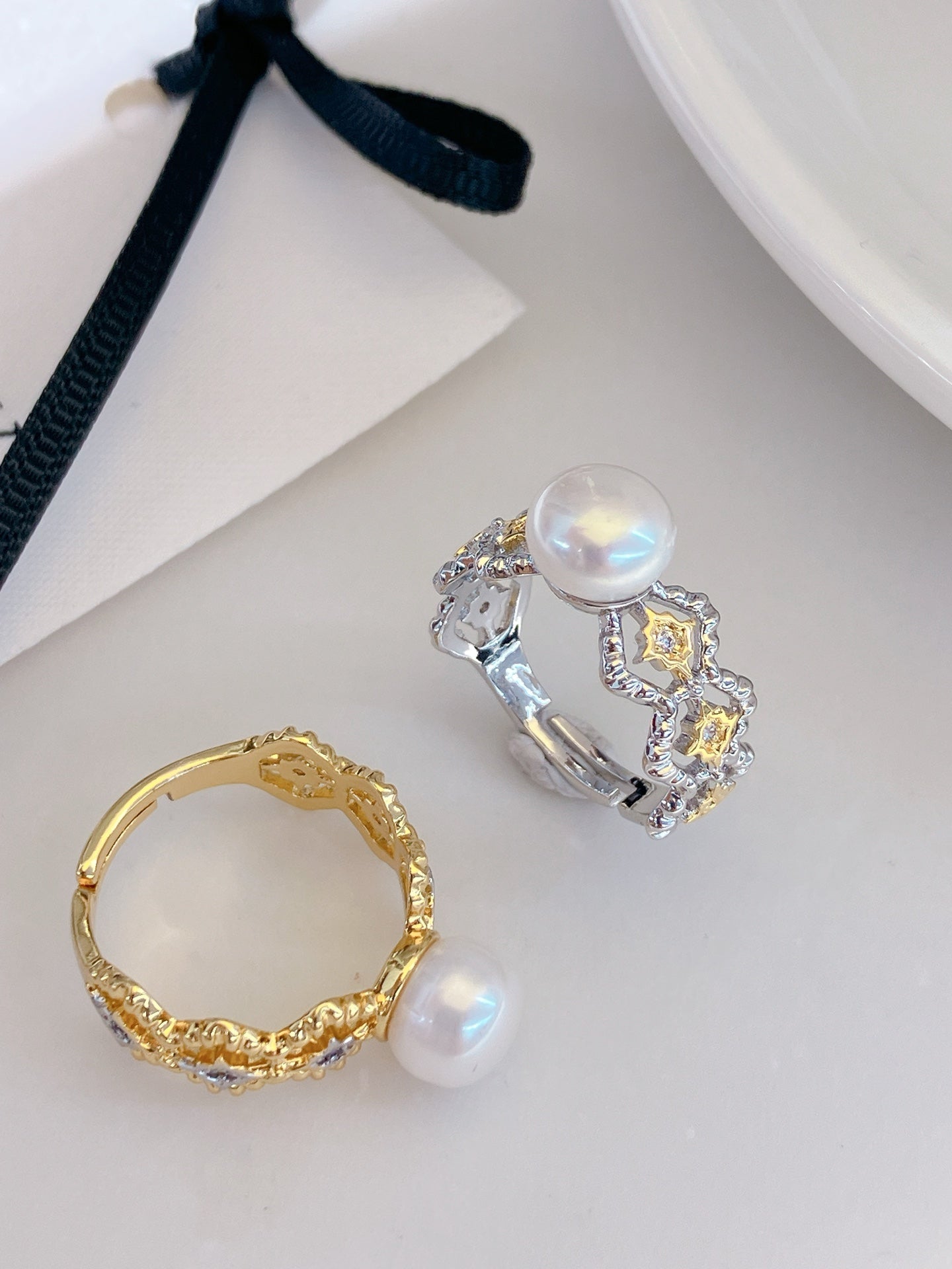 Adjustable gold open ring with geometric cut-out design and freshwater pearl