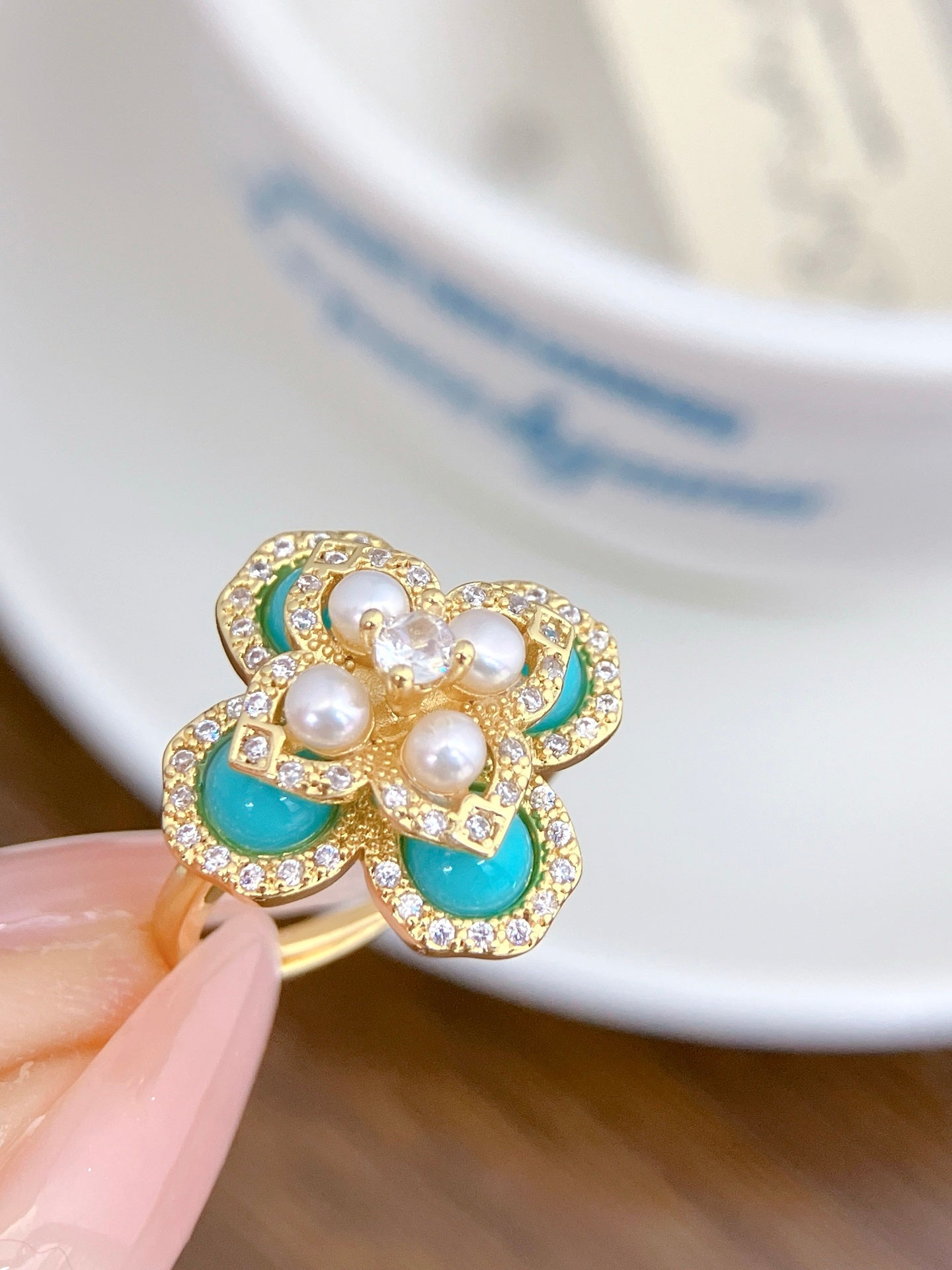 Sky blue clover pearl jewelry set with earrings, ring, and necklace
Vintage-style blue and pearl gift set by AnSes & Co.