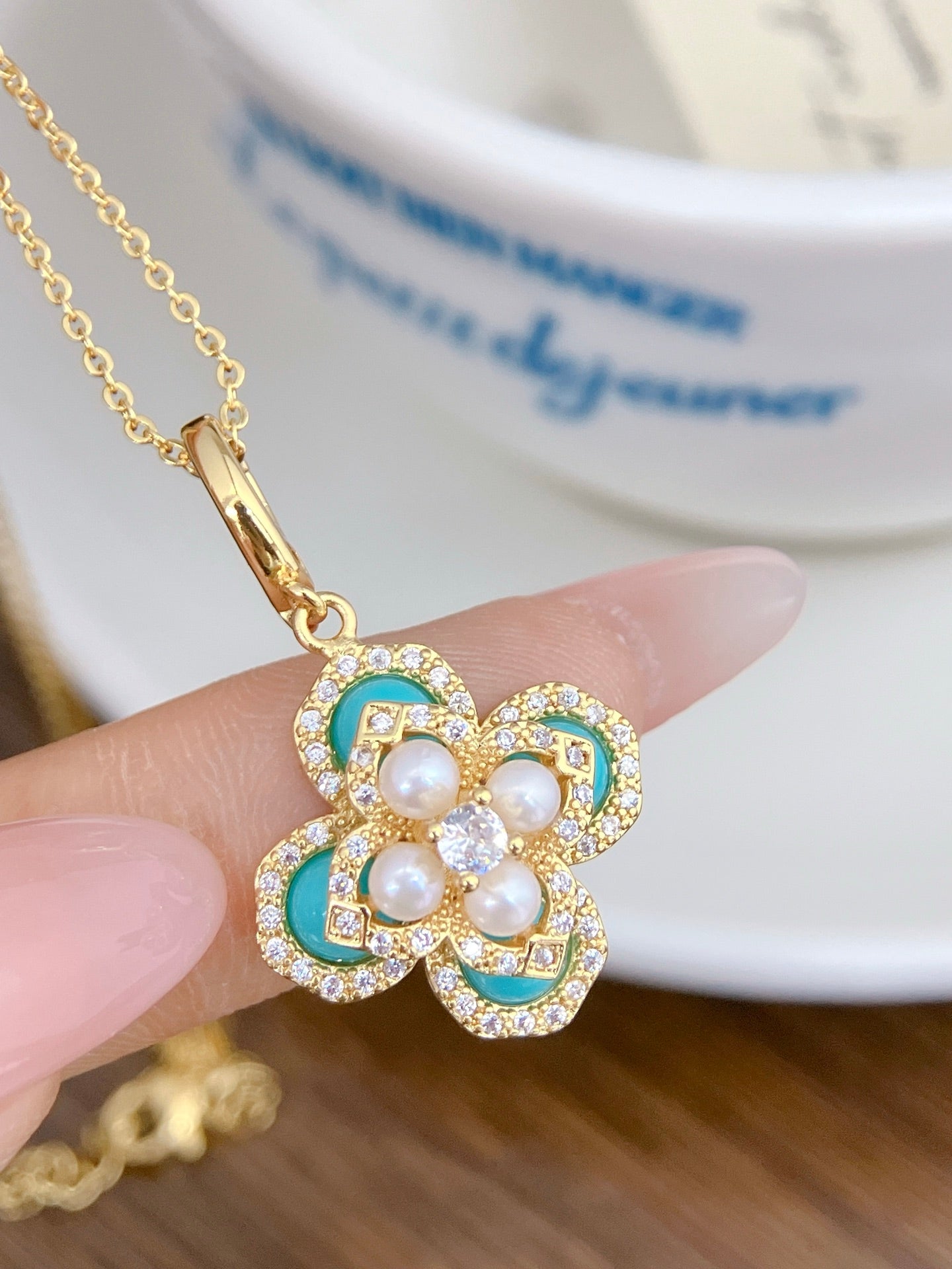 Sky blue clover pearl jewelry set with earrings, ring, and necklace
Vintage-style blue and pearl gift set by AnSes & Co.