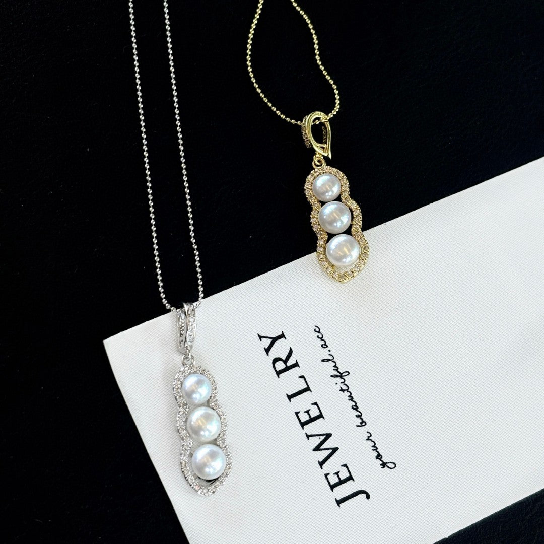 Vintage-style freshwater pearl drop pendant with bean clasp and 14K gold-plated adjustable chain