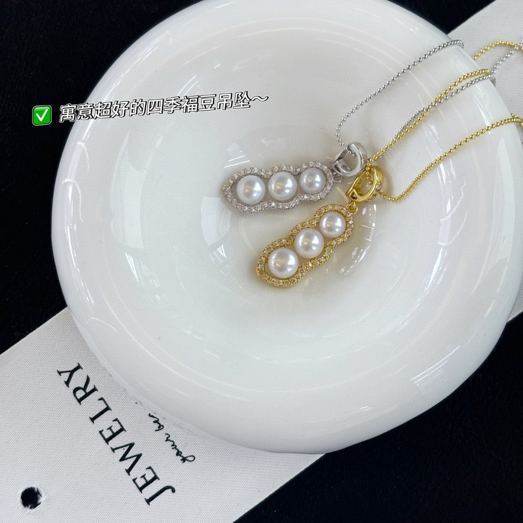 Vintage-style freshwater pearl drop pendant with bean clasp and 14K gold-plated adjustable chain