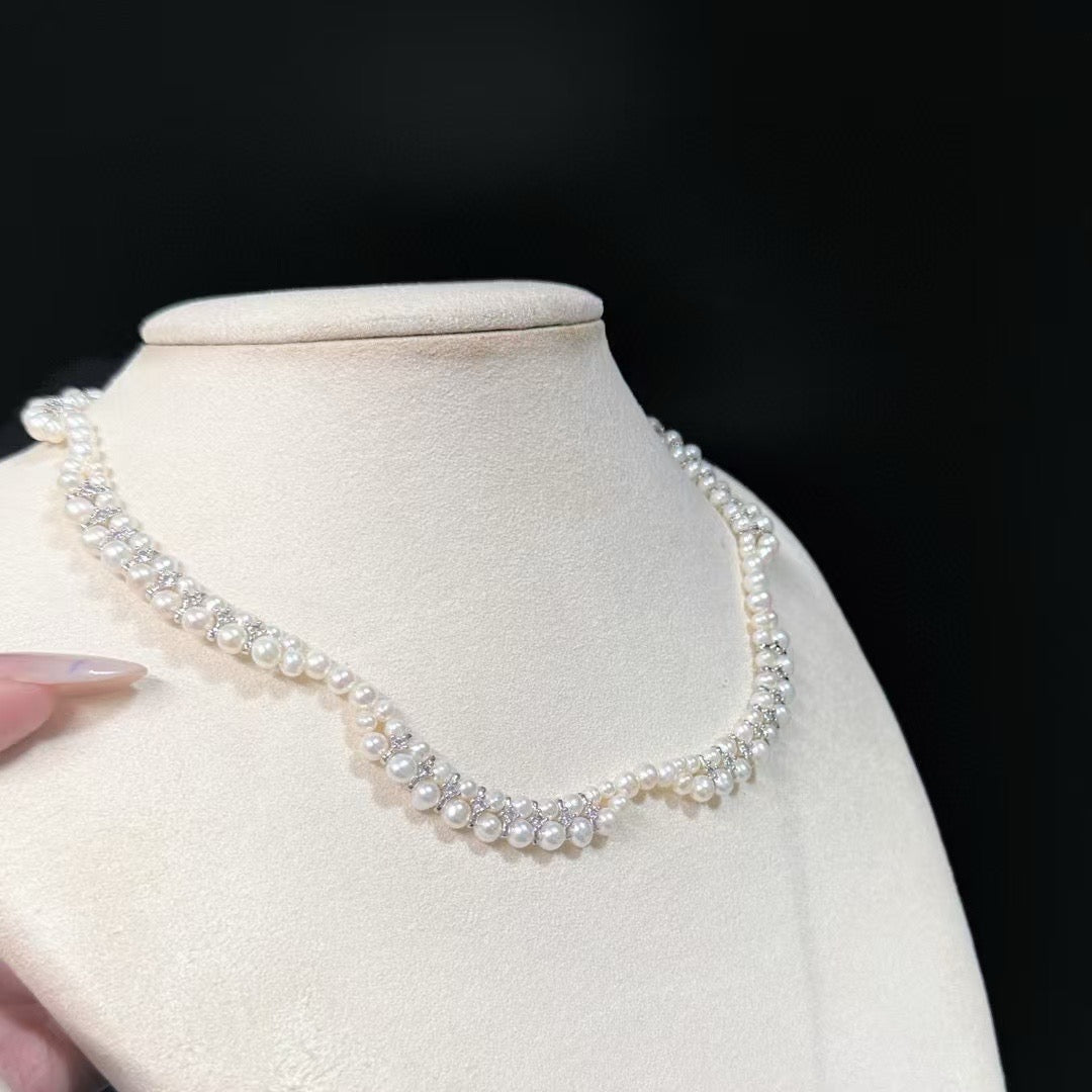 Floral wave design pearl necklace handcrafted with 3–5mm high-quality freshwater pearls, elegant artisan jewelry piece