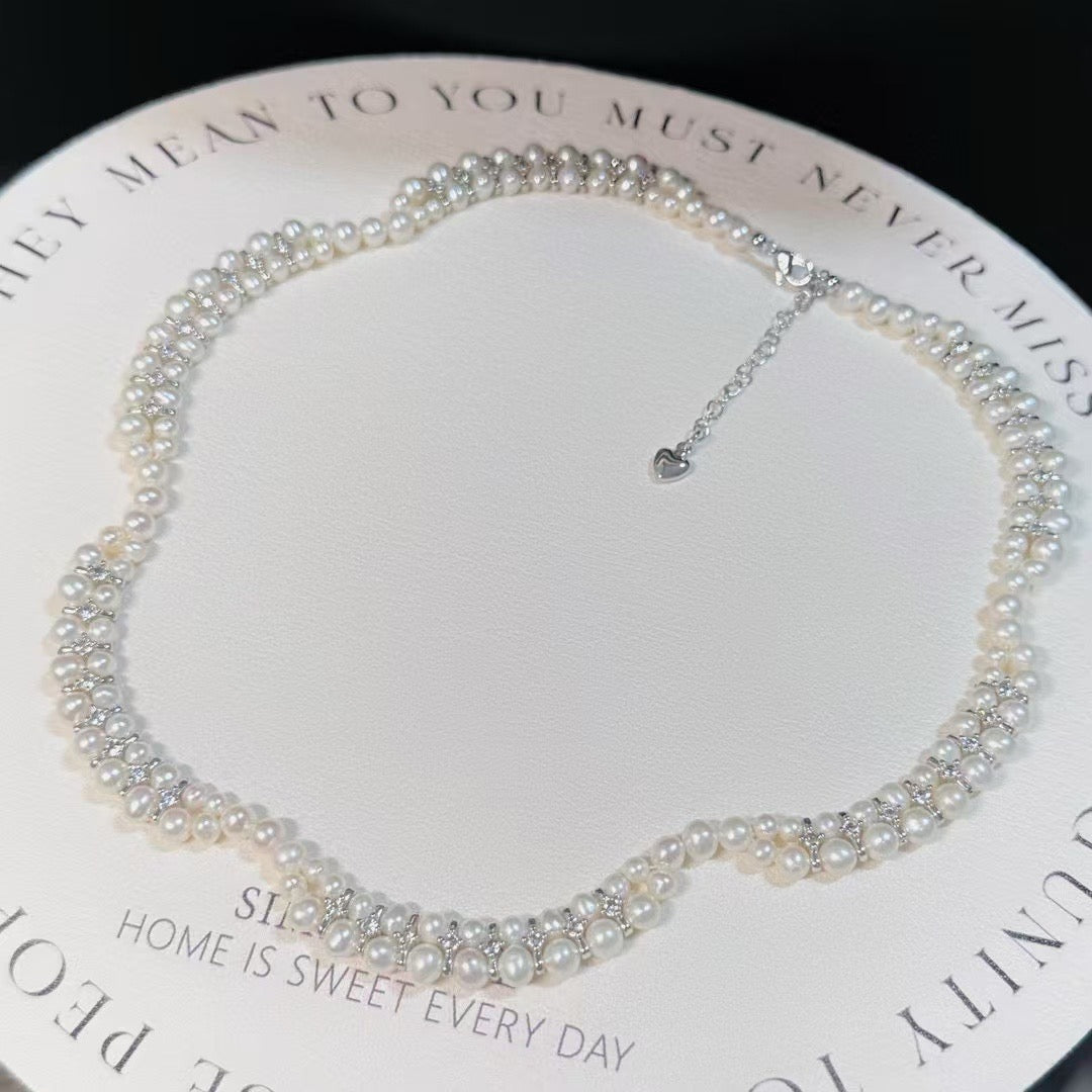 Floral wave design pearl necklace handcrafted with 3–5mm high-quality freshwater pearls, elegant artisan jewelry piece