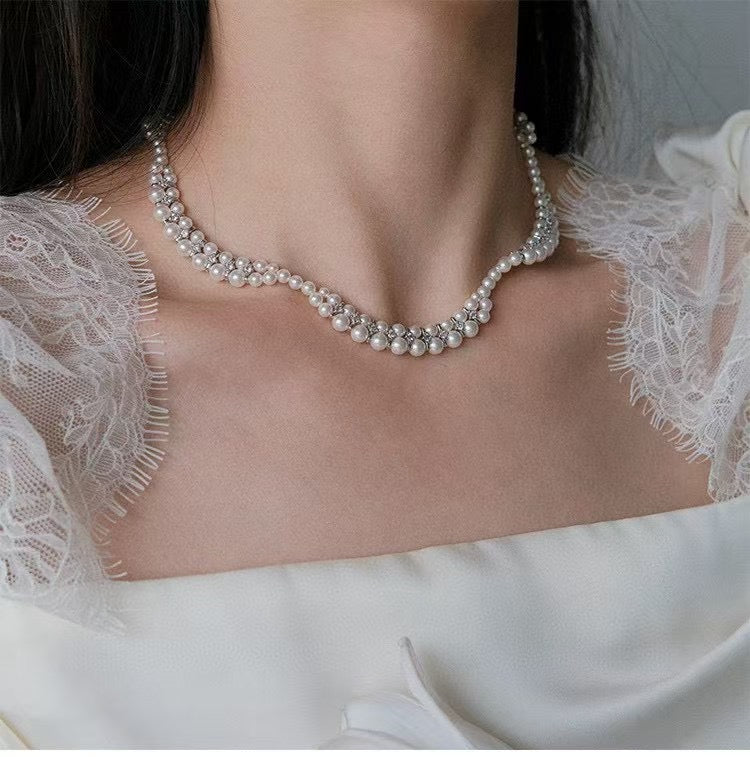 Floral wave design pearl necklace handcrafted with 3–5mm high-quality freshwater pearls, elegant artisan jewelry piece