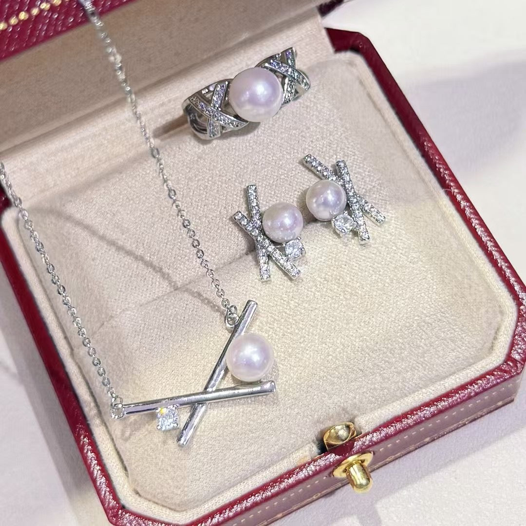 Three-piece pearl jewelry set with earrings, pendant, and ring in silver-tone 14k gold finish