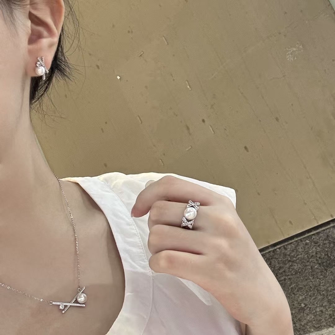 Three-piece pearl jewelry set with earrings, pendant, and ring in silver-tone 14k gold finish