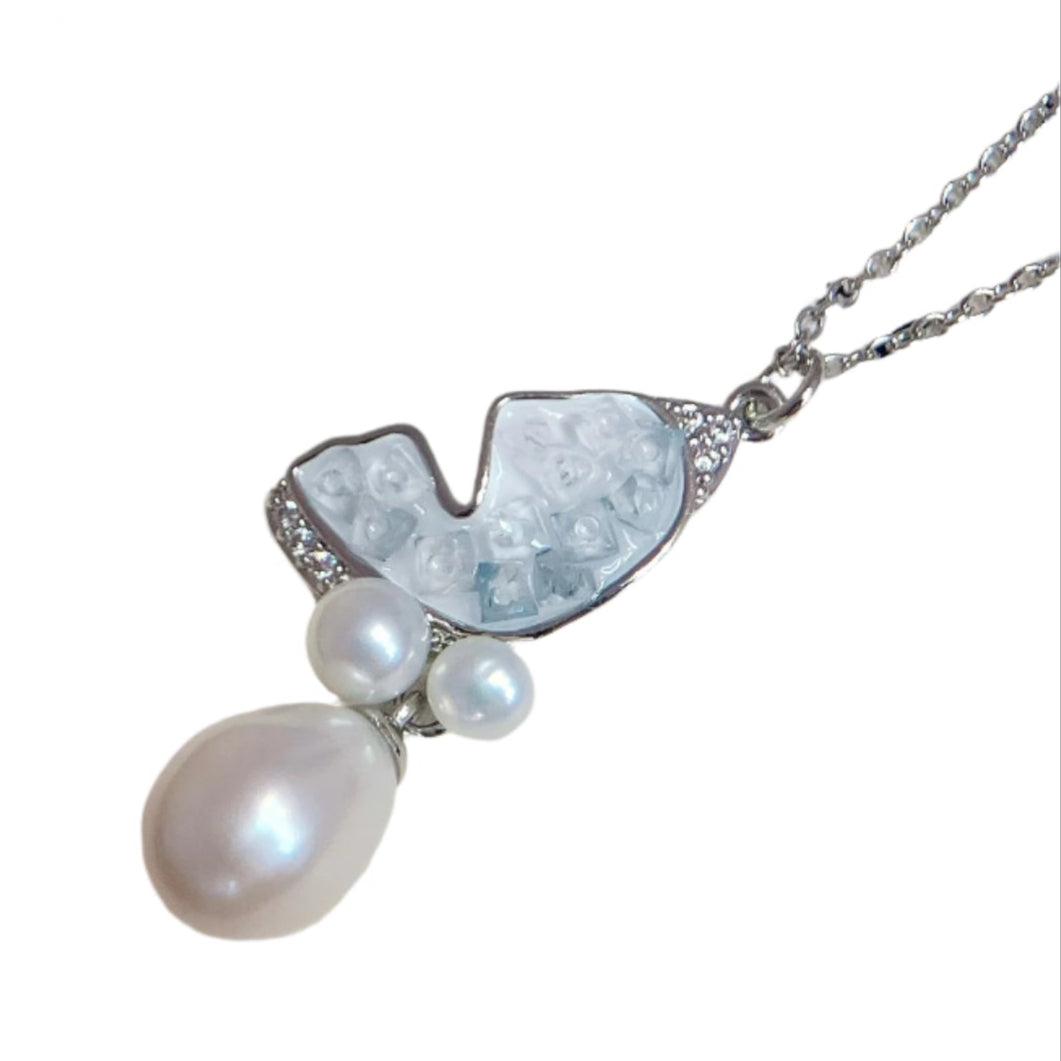 Close-up of butterfly pendant with high-luster freshwater pearls and 14K gold-filled chain