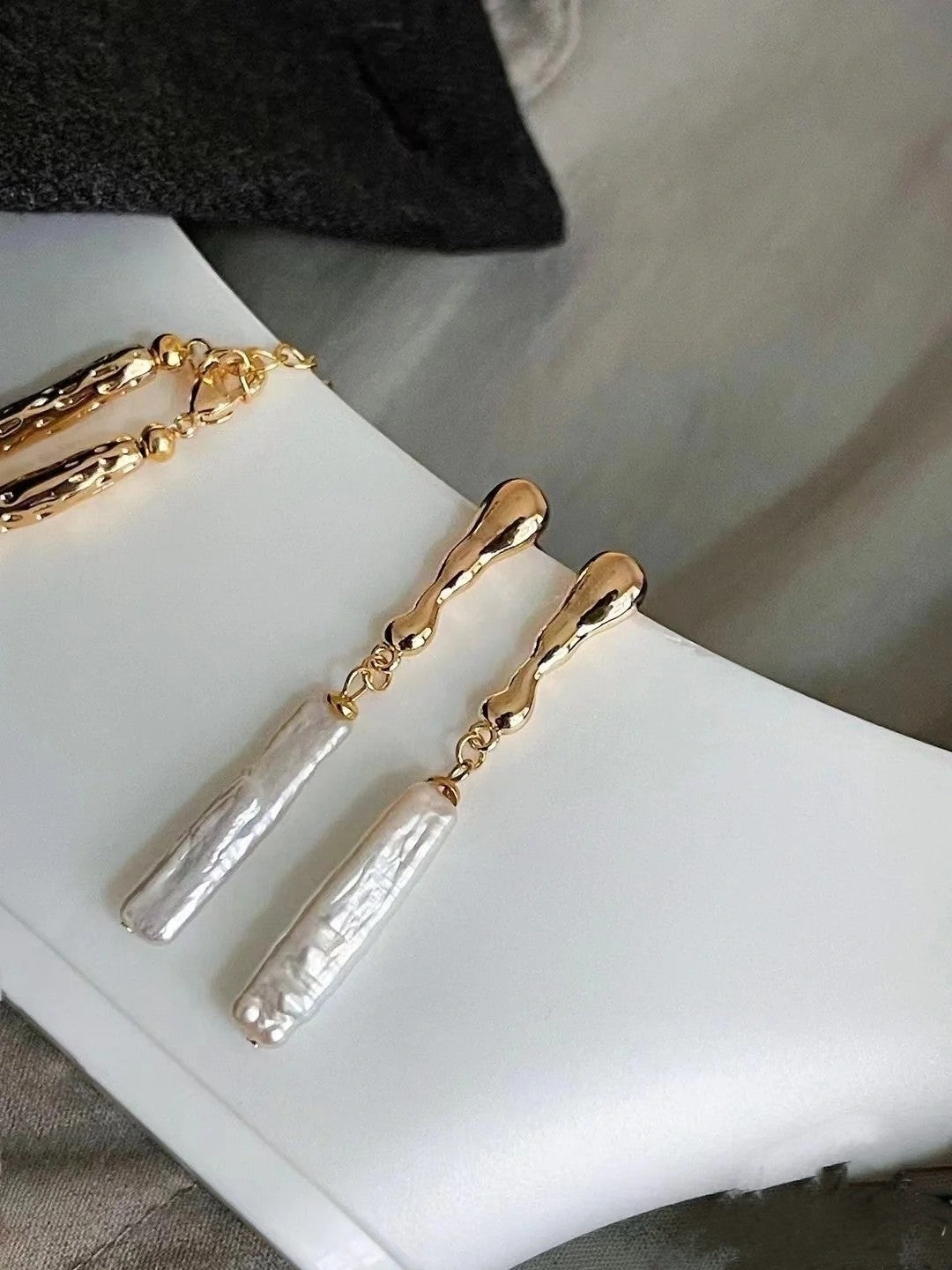 Close-up of irregular freshwater baroque pearls in gold or silver drop setting