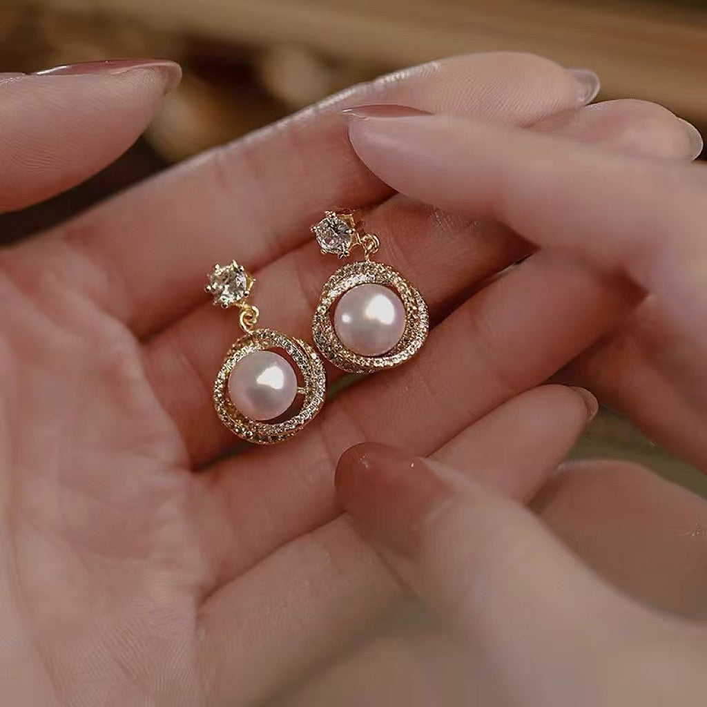 Close-up of high-luster pearl set on sterling silver post