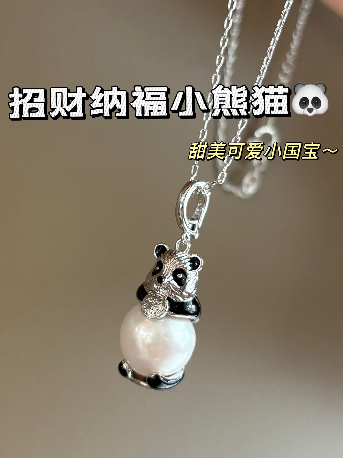Close-up of high-luster Edison pearl and panda charm