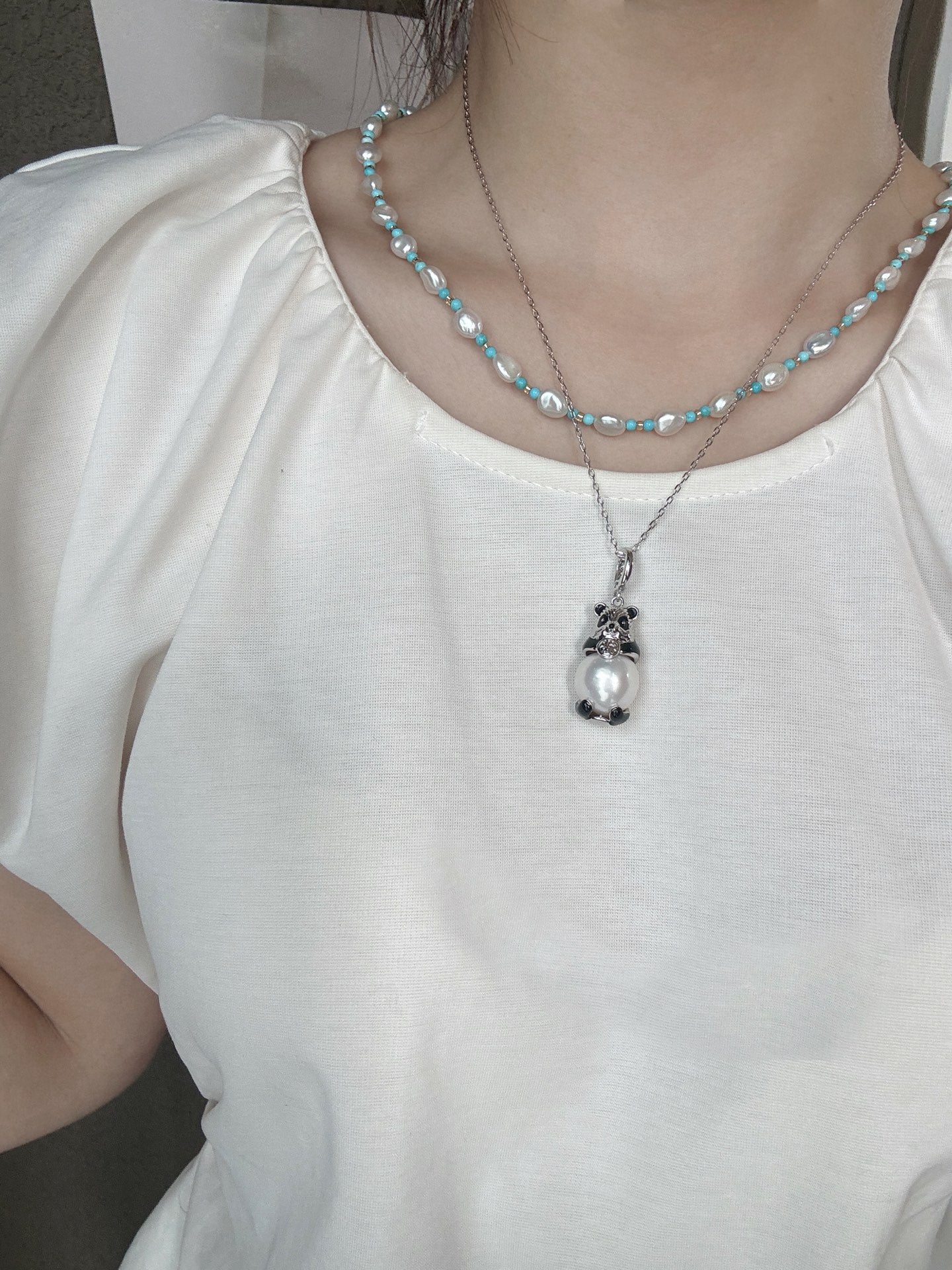 Model wearing cute panda pearl pendant necklace