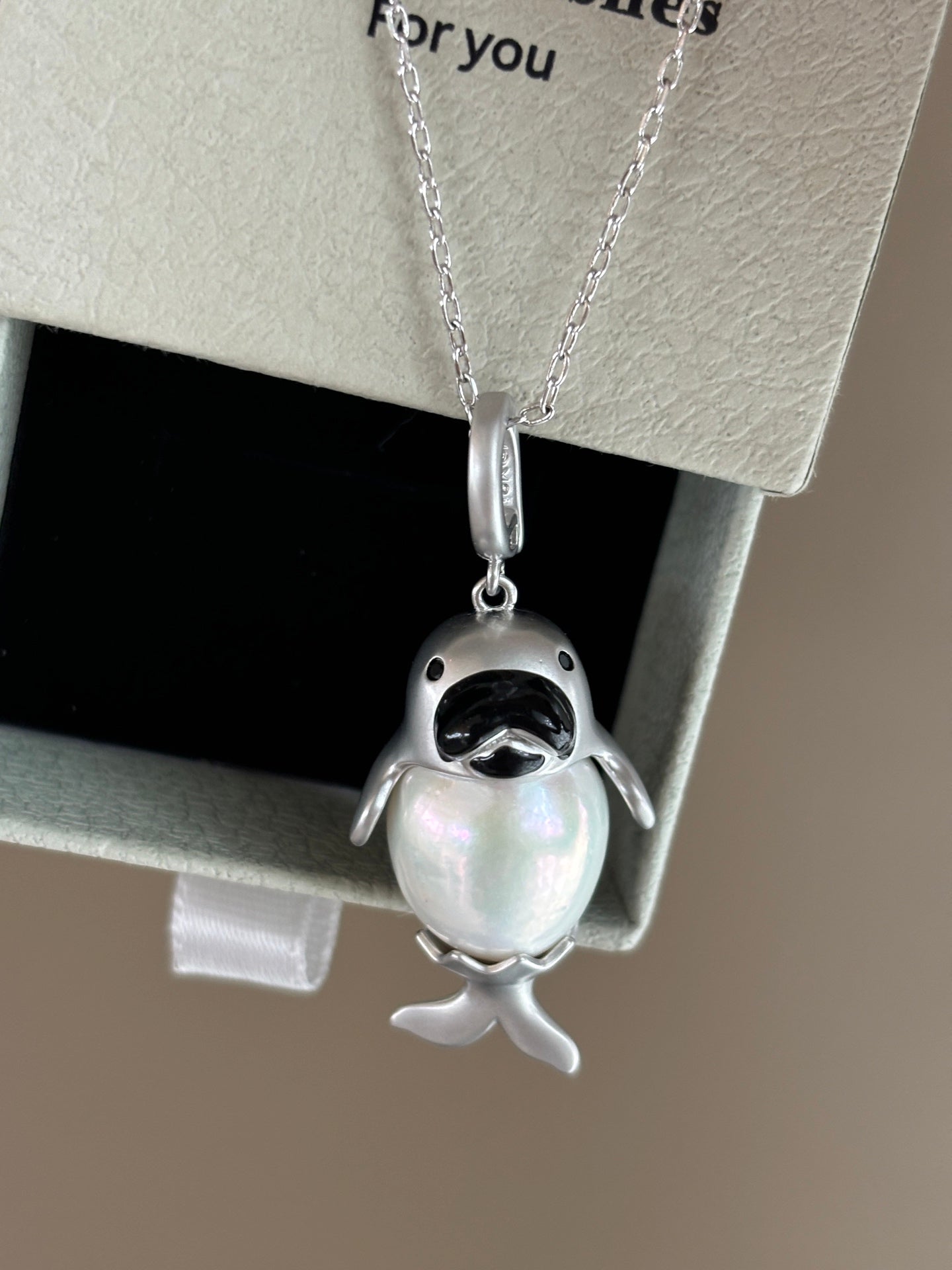 Close-up of baby seal design with 13–14mm high-luster pearl