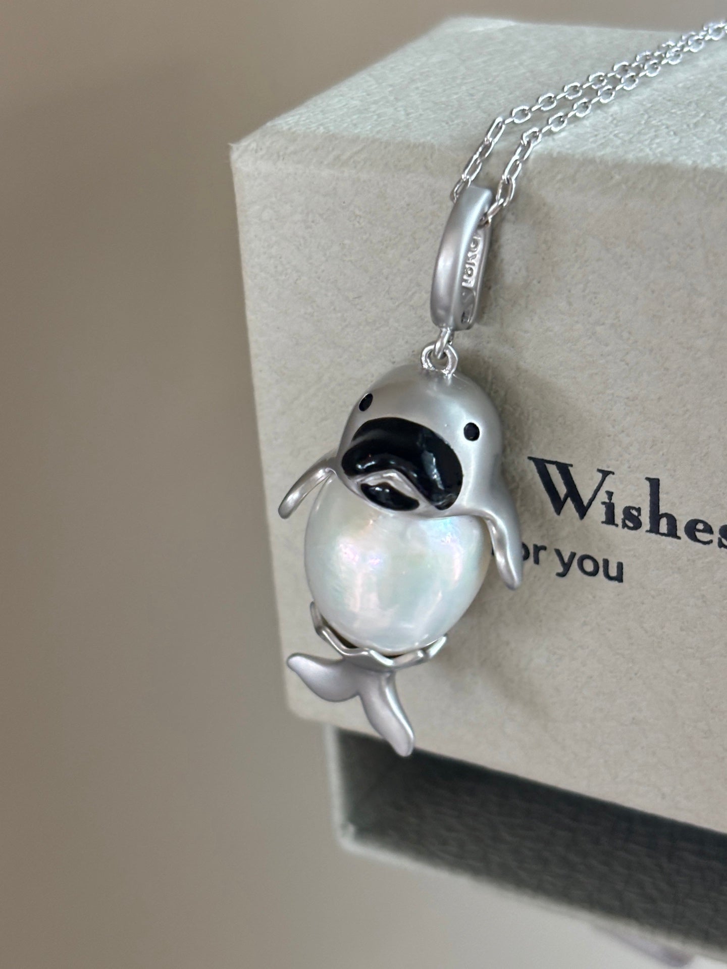 Close-up of baby seal design with 13–14mm high-luster pearl