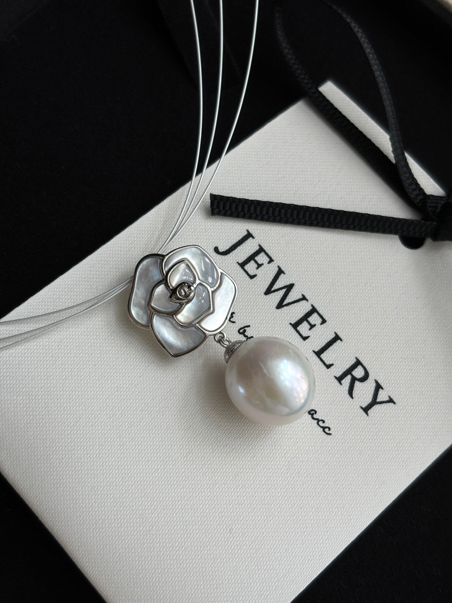 Close-up of camellia flower and 12mm teardrop pearl accent