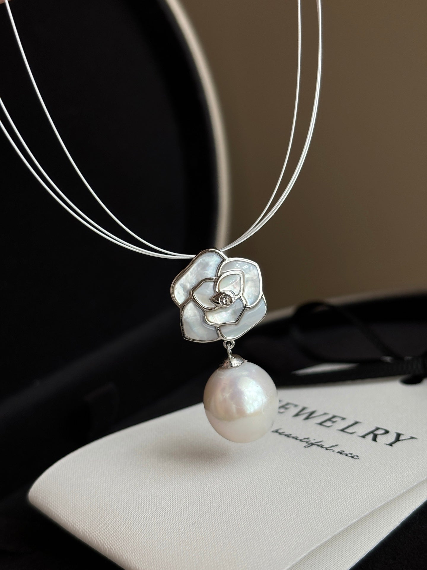 Close-up of camellia flower and 12mm teardrop pearl accent